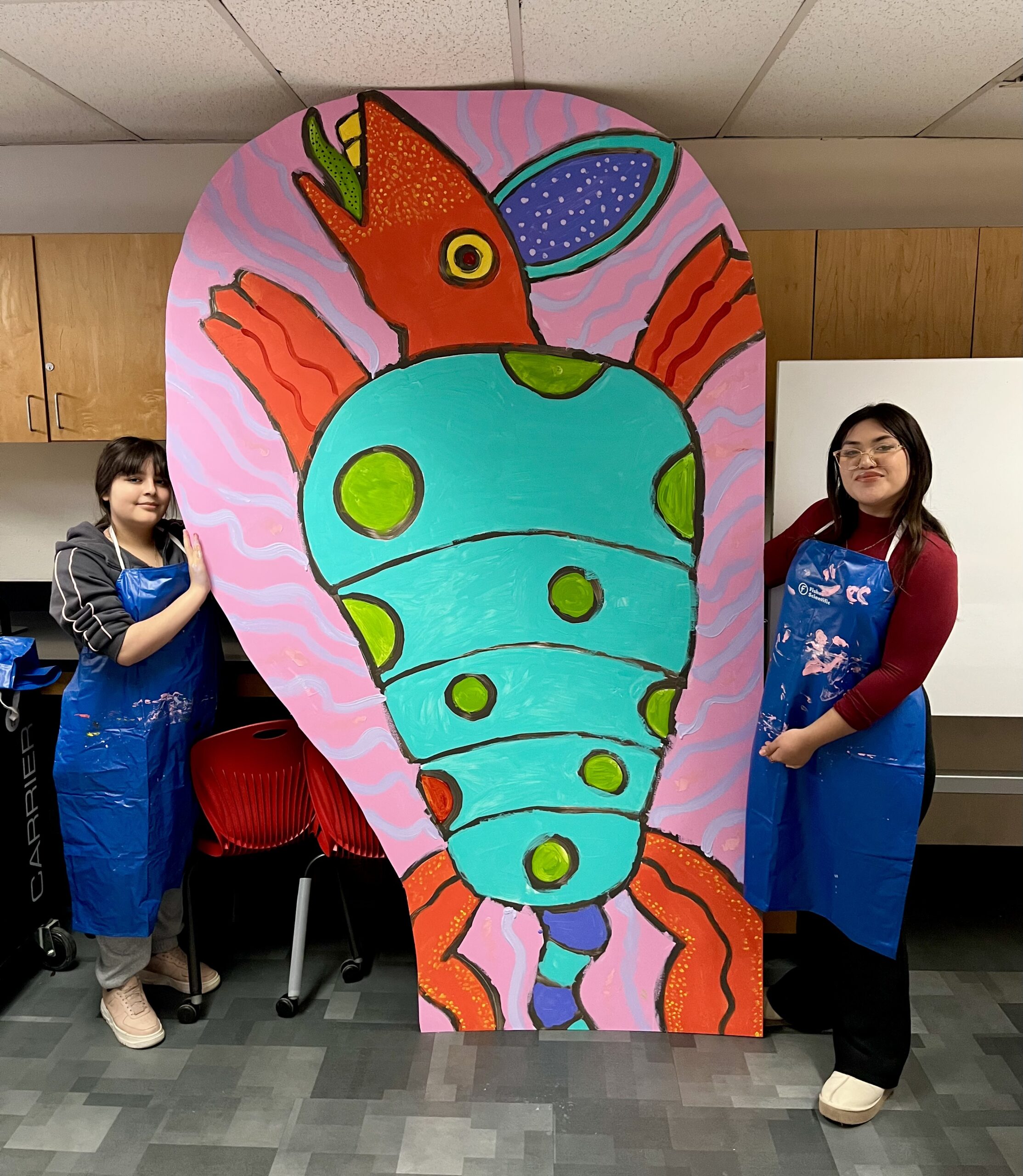 Two Alhambra MEChA Students w/ an Alebrije Panel